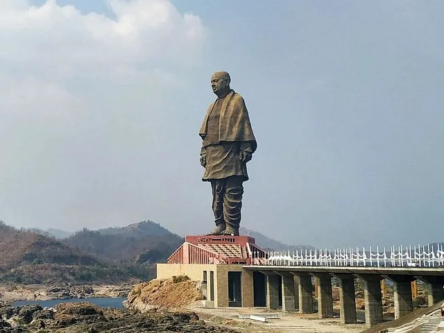 the Statue of Unity towering over the surrounding landscape and river