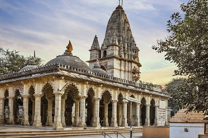 a large stone temple complex with detailed pillars and domes